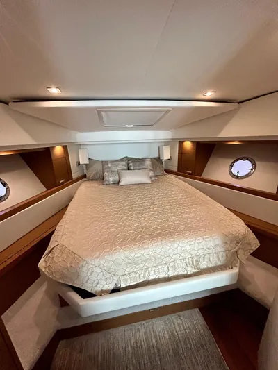  Yacht Photos Pics Luxurious cabin interior of 2022 Tiara Yachts C39 Coupe with elegant bedding.