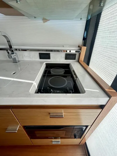  Yacht Photos Pics Modern kitchen in 2022 Tiara Yachts C39 Coupe with sleek stovetop and sink.