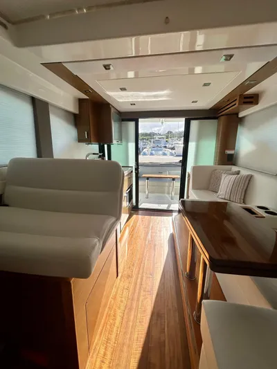  Yacht Photos Pics Interior of 2022 Tiara Yachts C39 Coupe with modern furnishings and wood flooring.