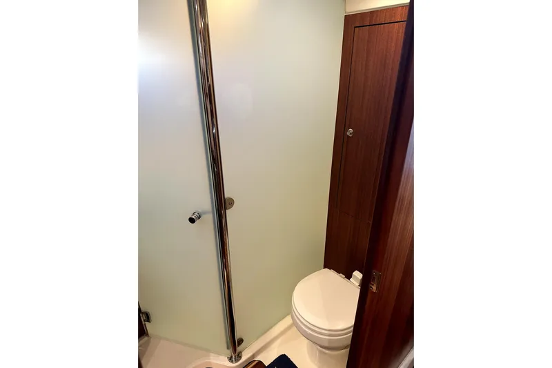 Change Of Pace Yacht Photos Pics Compact bathroom in 2014 PURSUITE 385 yacht with shower and toilet.