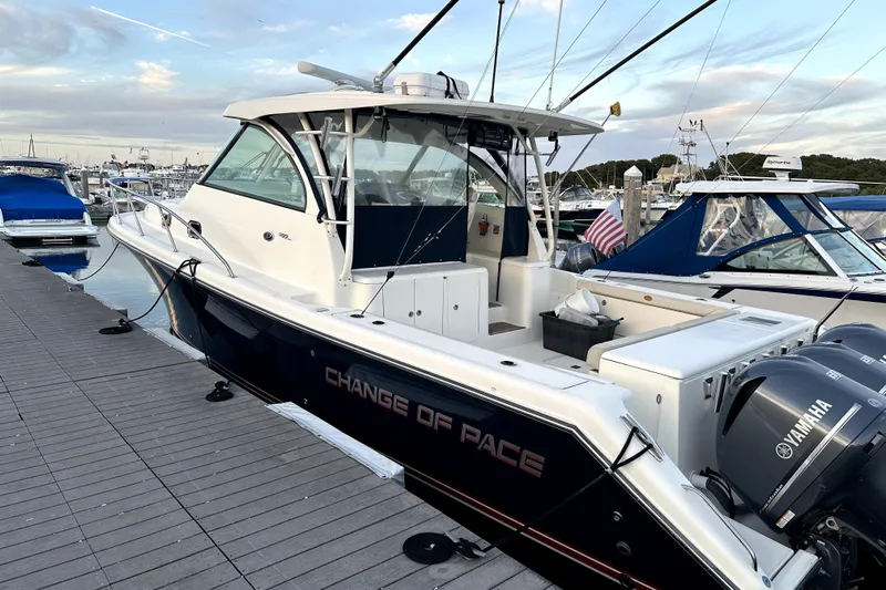 Change Of Pace Yacht Photos Pics 2014 PURSUITE 385 boat docked, featuring Yamaha engines and "Change of Pace" name.