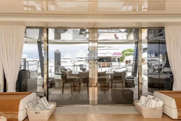 Fat Cat Yacht Photos Pics Luxurious 2024 Sunreef Fat Cat yacht interior with elegant seating and marina view.