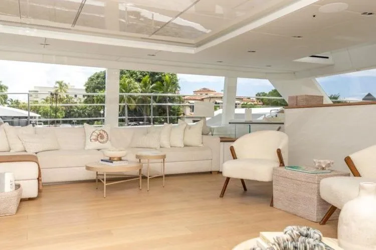 Fat Cat Yacht Photos Pics Luxurious interior of 2024 Sunreef Fat Cat yacht with elegant seating and panoramic windows.