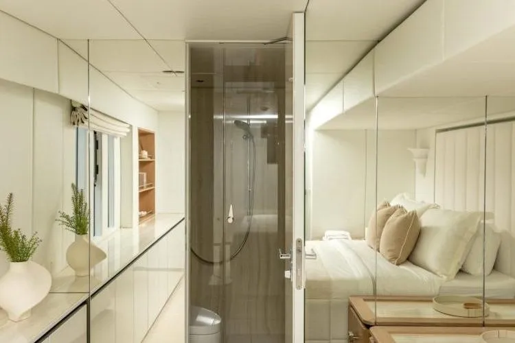 Fat Cat Yacht Photos Pics Luxurious interior of 2024 Sunreef Fat Cat yacht with modern bedroom and bathroom design.