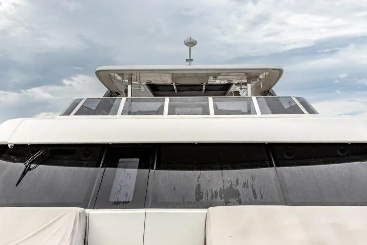 Fat Cat Yacht Photos Pics 2024 Sunreef Fat Cat yacht, sleek design under cloudy sky.