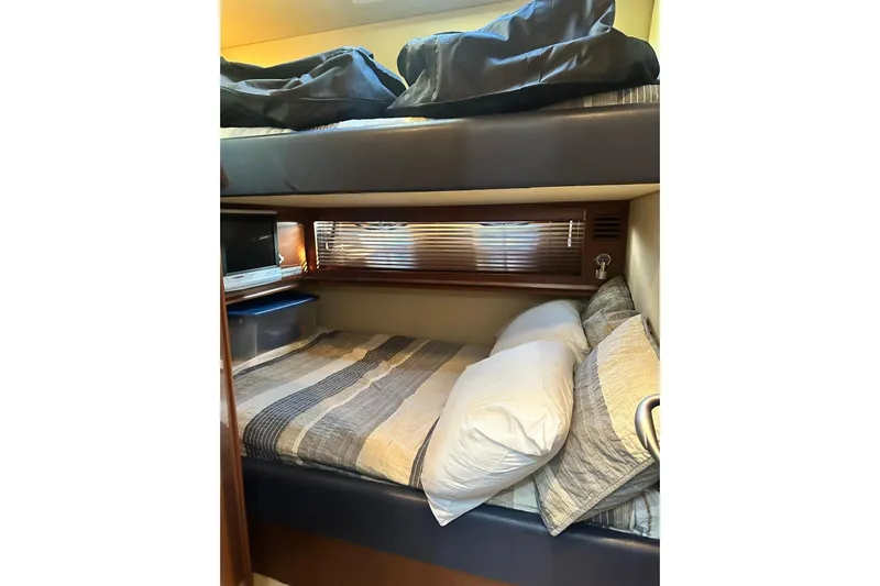  Yacht Photos Pics Cozy cabin interior of 2006 Sea Ray 52 Sundancer yacht with bunk beds.