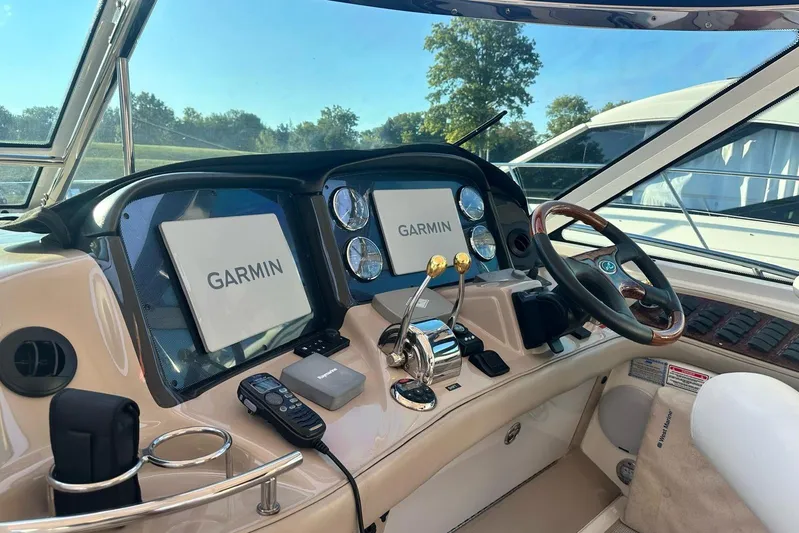  Yacht Photos Pics Helm of 2006 Sea Ray 52 Sundancer with Garmin navigation displays and controls.