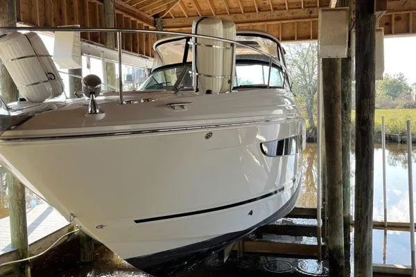  Yacht Photos Pics 2017 Sea Ray Sundancer 350 docked in a covered marina, side view.