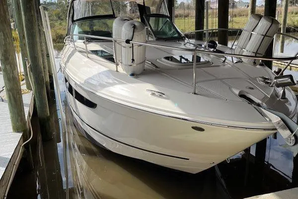  Yacht Photos Pics 2017 Sea Ray Sundancer 350 docked in a covered marina.