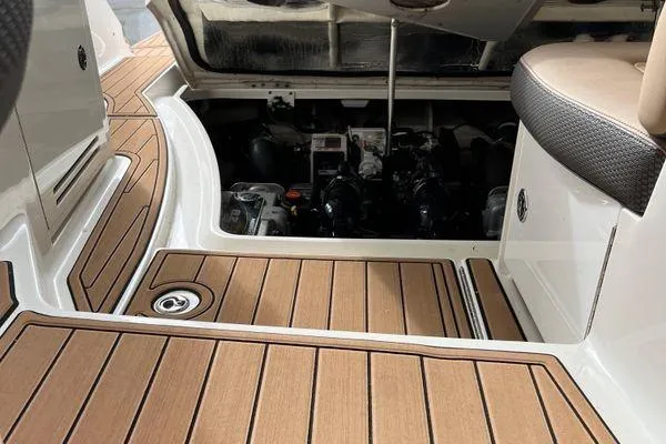  Yacht Photos Pics 2017 Sea Ray Sundancer 350 engine compartment with teak flooring and seating area.