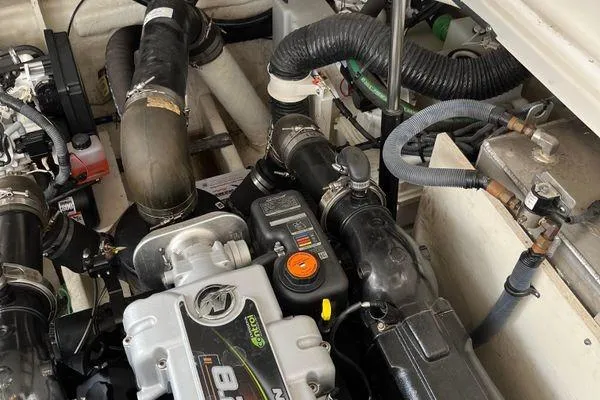  Yacht Photos Pics Engine compartment of a 2017 Sea Ray Sundancer 350 boat, showcasing mechanical components.