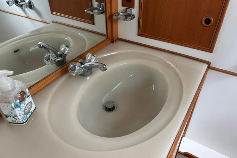  Yacht Photos Pics Bathroom sink with chrome faucet on 1991 Grand Banks 36 Classic yacht.