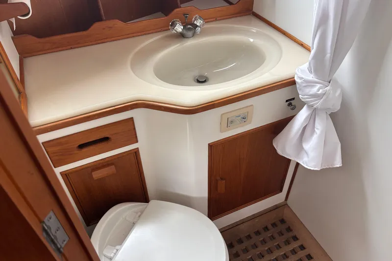  Yacht Photos Pics Bathroom interior of 1991 Grand Banks 36 Classic yacht with sink and toilet.