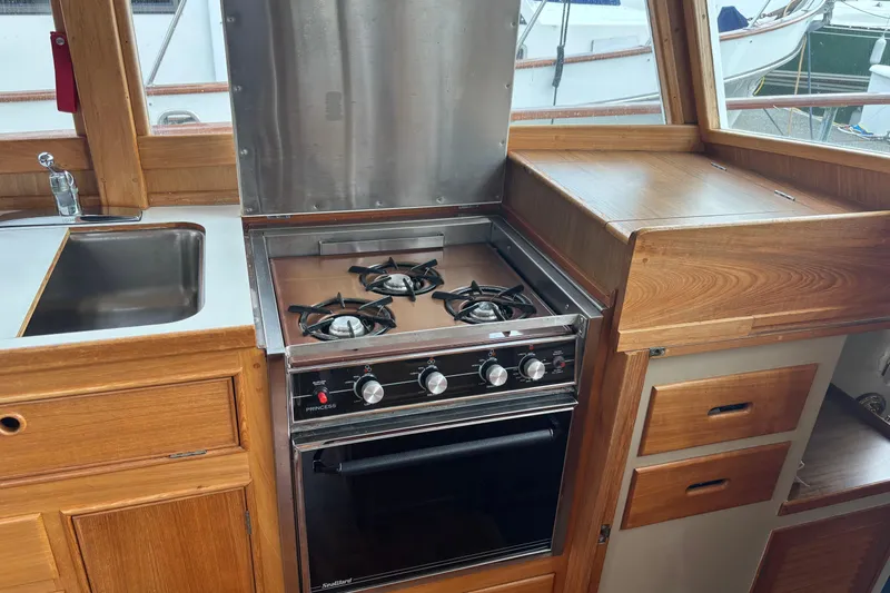  Yacht Photos Pics 1991 Grand Banks 36 Classic yacht kitchen with stove, oven, and sink.