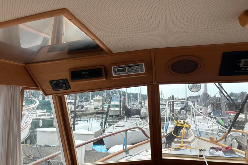  Yacht Photos Pics Interior view of a 1991 Grand Banks 36 Classic yacht with marina in background.