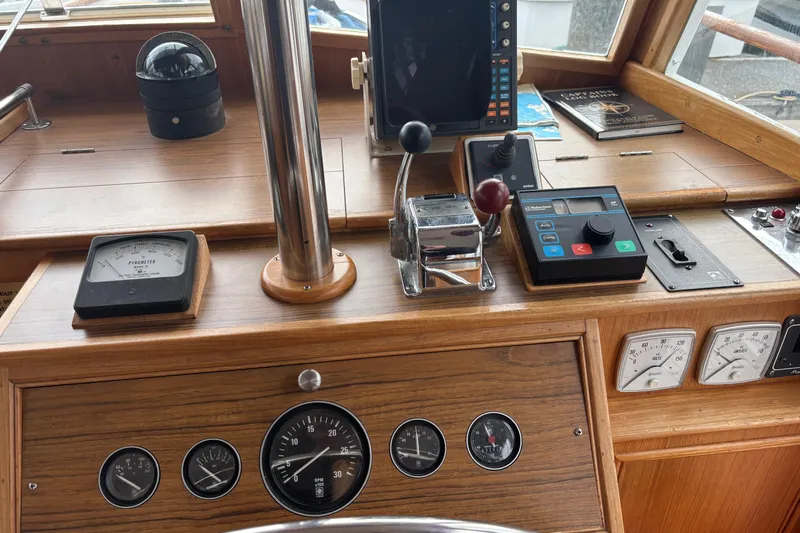  Yacht Photos Pics Helm of 1991 Grand Banks 36 Classic with navigation instruments and controls.