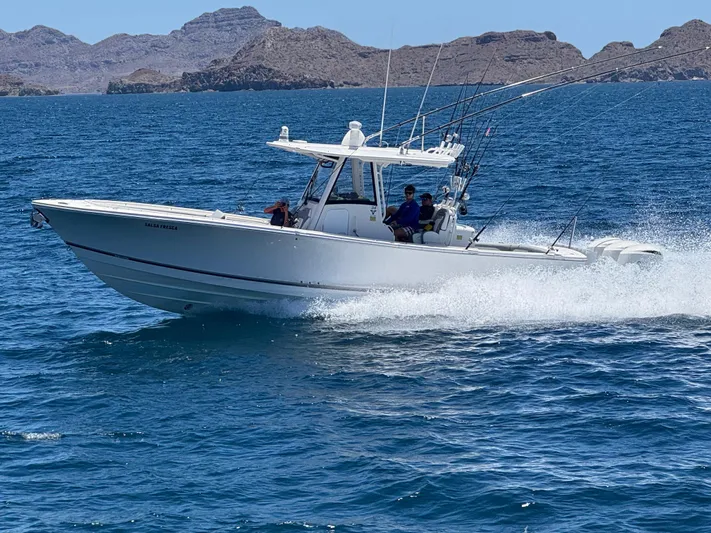  Yacht Photos Pics 2020 Regulator 34 Center Console boat cruising on blue ocean waters.