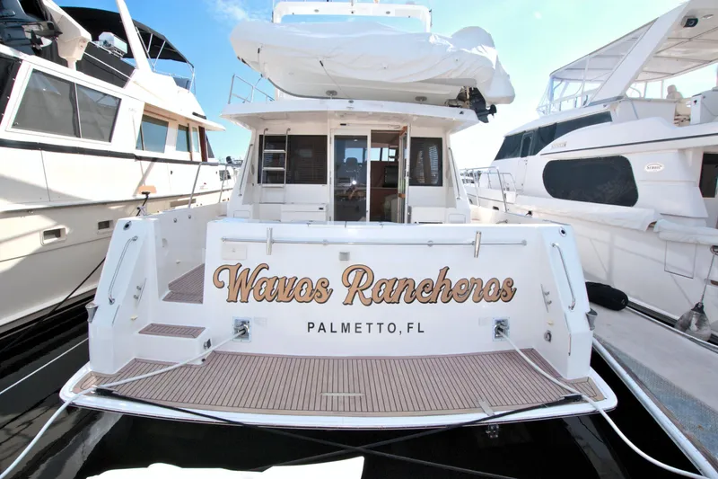 Wavos Rancheros Yacht Photos Pics West Bay 58 Sonship yacht, 1999 model, docked in Palmetto, FL, named "Wavos Rancheros".