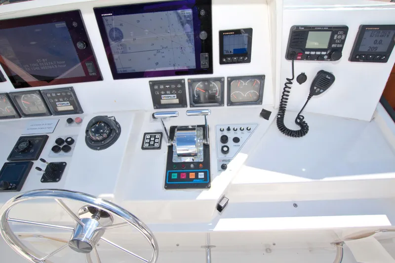 Wavos Rancheros Yacht Photos Pics Control panel of a 1999 West Bay 58 Sonship yacht with navigation and communication equipment.