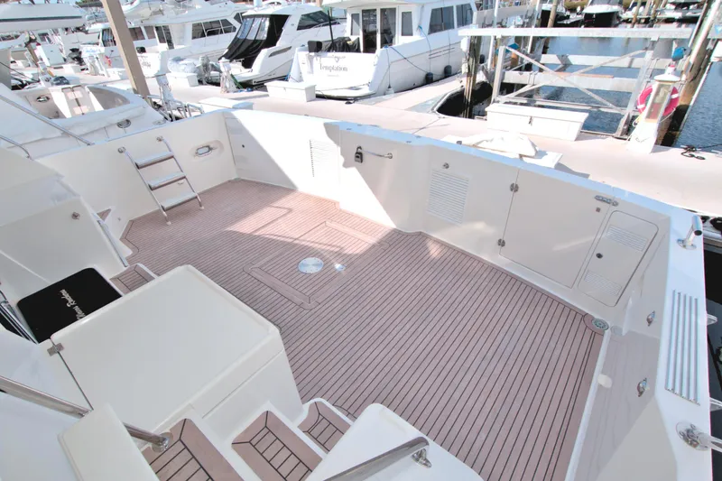 Wavos Rancheros Yacht Photos Pics 1999 West Bay 58 Sonship yacht deck with spacious seating and modern design.