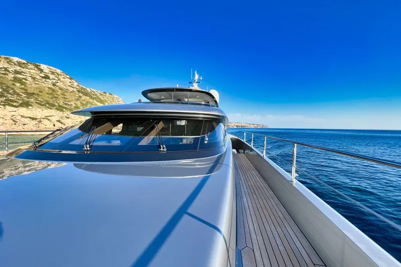 Smooth Operator Yacht Photos Pics Luxurious 2011 Jongert 39m yacht cruising along a scenic coastline under clear blue skies.