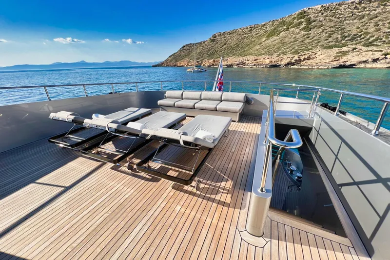 Smooth Operator Yacht Photos Pics Luxurious deck of 2011 Jongert 39m yacht with sun loungers and scenic ocean view.