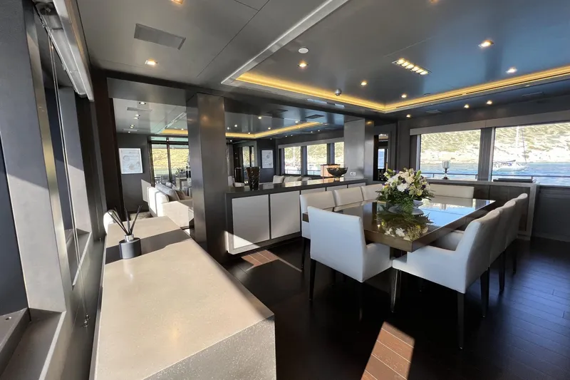 Smooth Operator Yacht Photos Pics Luxurious interior of 2011 Jongert 39m yacht with elegant dining area and panoramic windows.