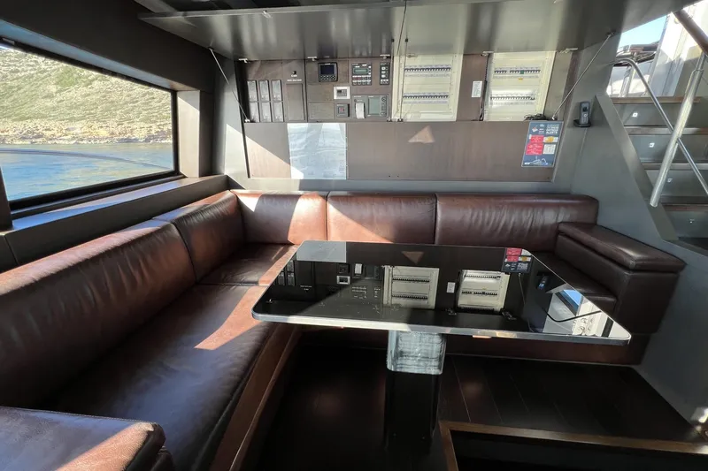 Smooth Operator Yacht Photos Pics Luxurious interior of 2011 Jongert 39m yacht with leather seating and modern control panels.