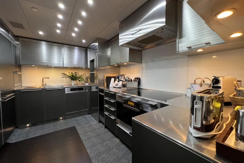 Smooth Operator Yacht Photos Pics Luxurious modern kitchen on 2011 Jongert 39m yacht, featuring sleek stainless steel appliances.
