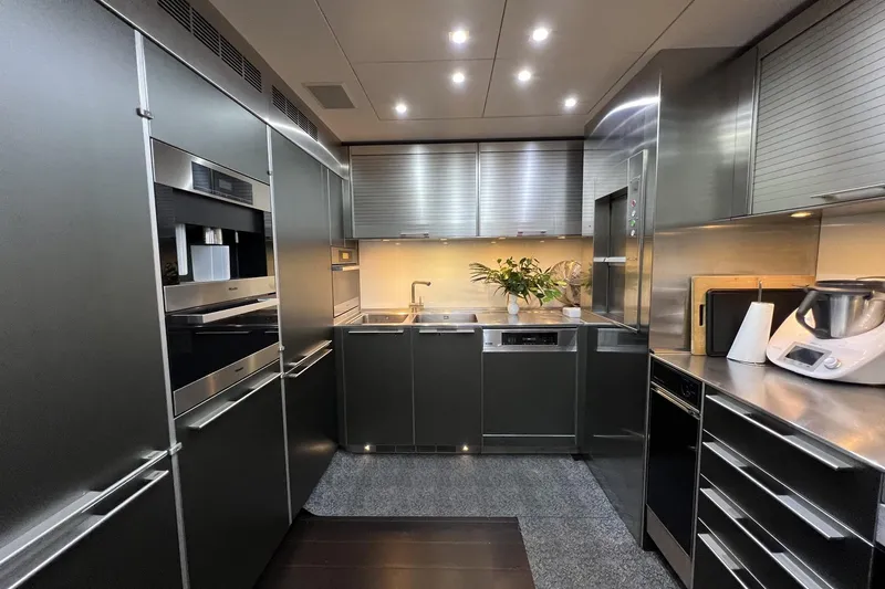 Smooth Operator Yacht Photos Pics Modern kitchen interior on 2011 Jongert 39m yacht, featuring sleek stainless steel appliances.