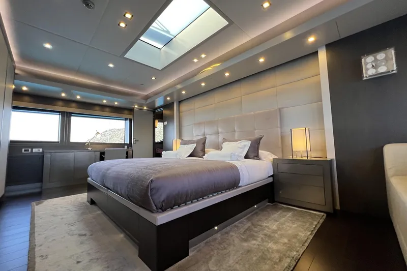 Smooth Operator Yacht Photos Pics Luxurious bedroom interior on 2011 Jongert 39m yacht, featuring modern design and elegant lighting.
