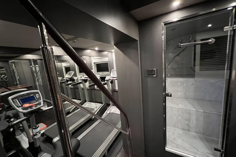 Smooth Operator Yacht Photos Pics Luxurious gym on 2011 Jongert 39m yacht with modern equipment and sleek design.