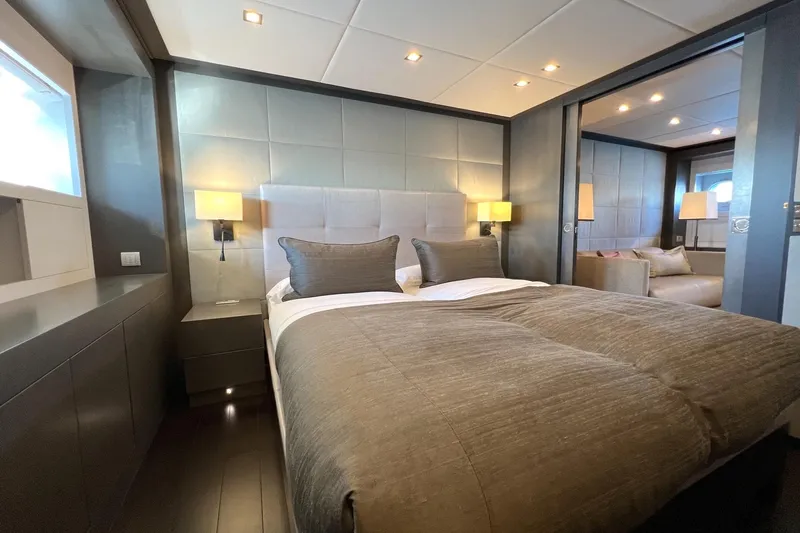 Smooth Operator Yacht Photos Pics Luxurious bedroom interior on 2011 Jongert 39m yacht, featuring elegant bedding and modern lighting.