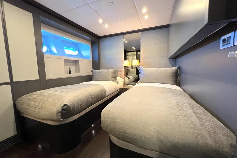 Smooth Operator Yacht Photos Pics Luxurious twin cabin interior on 2011 Jongert 39m yacht, featuring modern design and ambient lighting.