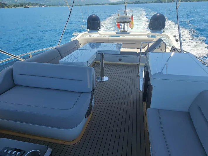  Yacht Photos Pics 2024 Galeon 440 Fly yacht deck with seating, table, and ocean view.