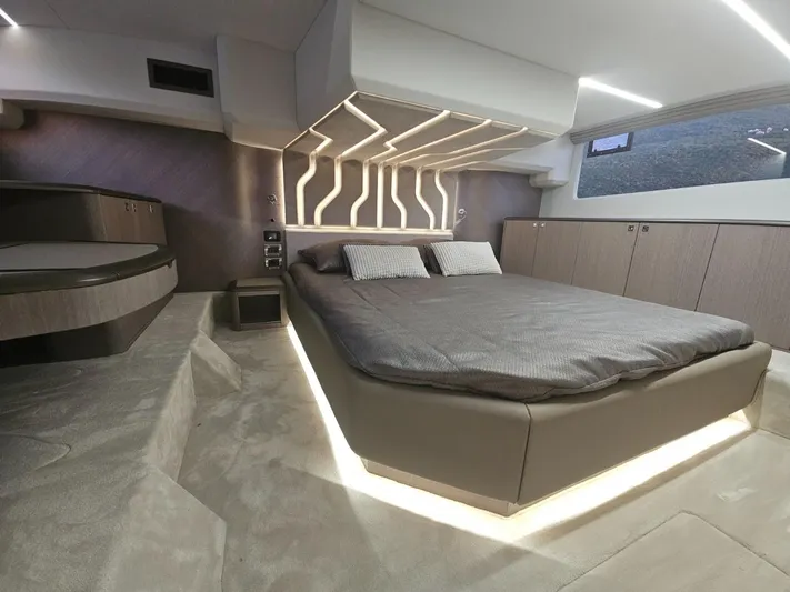  Yacht Photos Pics Luxurious bedroom interior of 2024 Galeon 440 Fly yacht with modern design and ambient lighting.