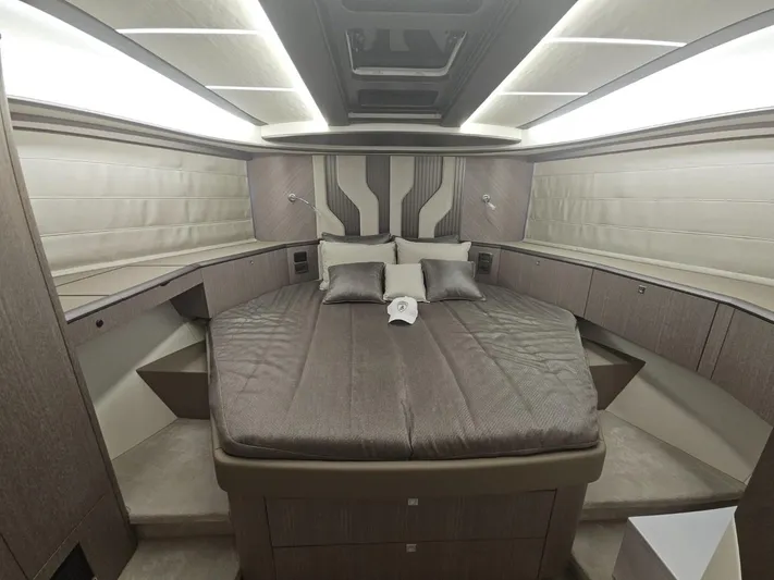  Yacht Photos Pics Luxurious bedroom interior of 2024 Galeon 440 Fly yacht with modern design and ambient lighting.
