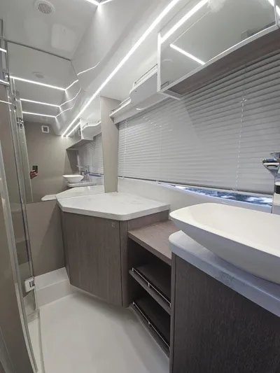  Yacht Photos Pics Luxurious bathroom interior of 2024 Galeon 440 Fly yacht with modern fixtures and sleek design.
