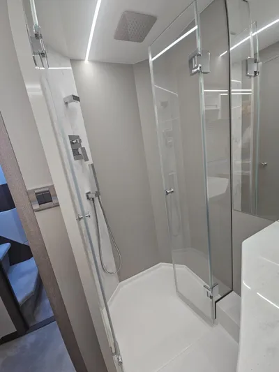  Yacht Photos Pics Modern shower cabin in 2024 Galeon 440 Fly yacht, featuring sleek glass doors and contemporary fixtures.