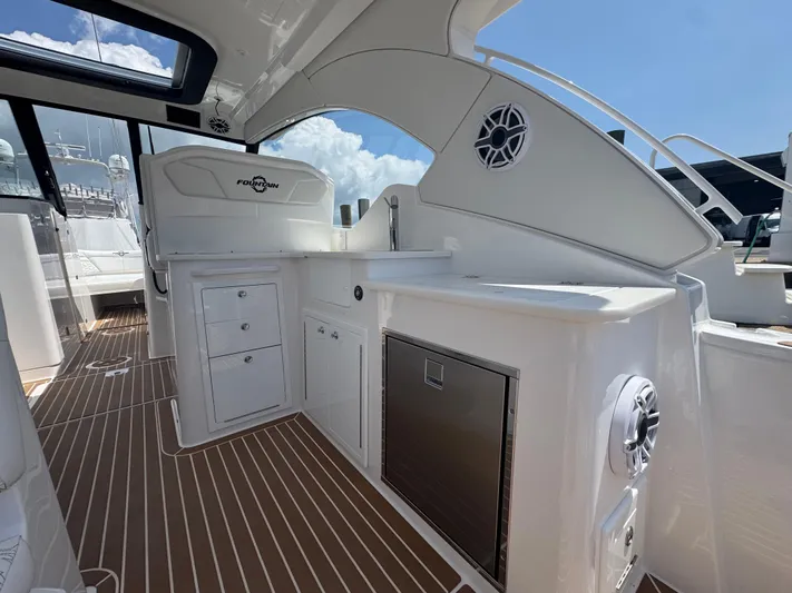  Yacht Photos Pics 2025 Fountain 39 DX boat interior with sleek design, white cabinetry, and modern amenities.