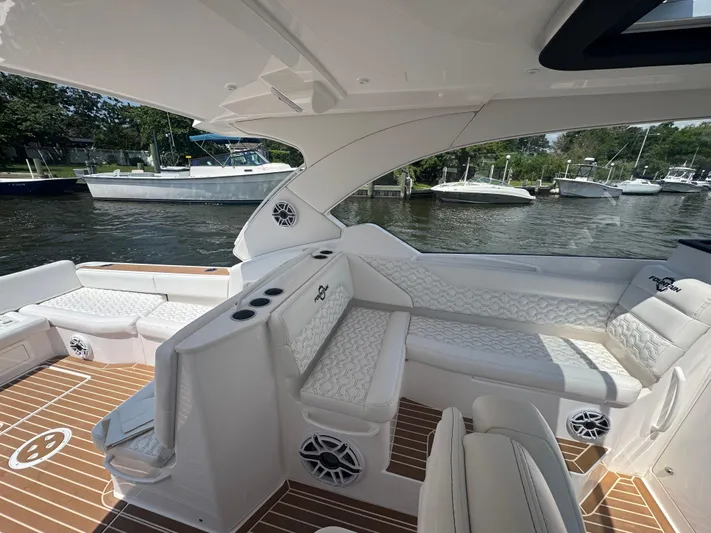  Yacht Photos Pics Luxurious interior of 2025 Fountain 39 DX boat with elegant seating and modern design.