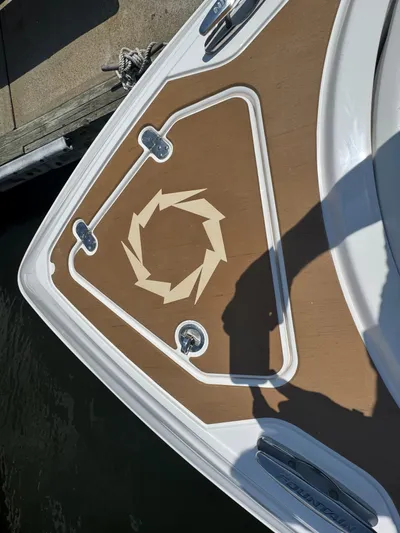  Yacht Photos Pics 2025 Fountain 39 DX boat deck with geometric design and cleats, docked by water.