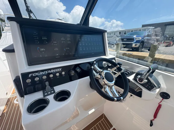  Yacht Photos Pics 2025 Fountain 39 DX boat dashboard with advanced controls and digital displays.