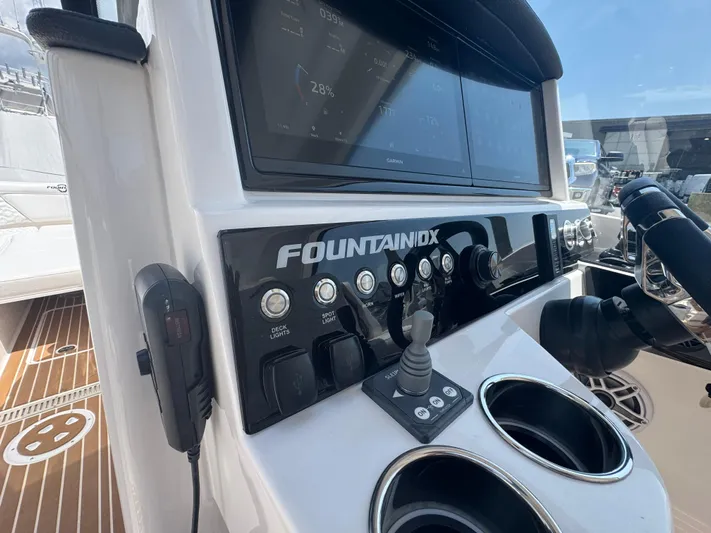  Yacht Photos Pics Control panel of 2025 Fountain 39 DX boat with navigation screens and switches.