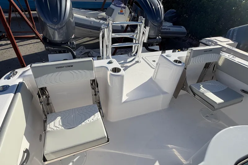  Yacht Photos Pics 2026 Twin Vee 280 GFX2 CC boat interior with seating and dual outboard motors.