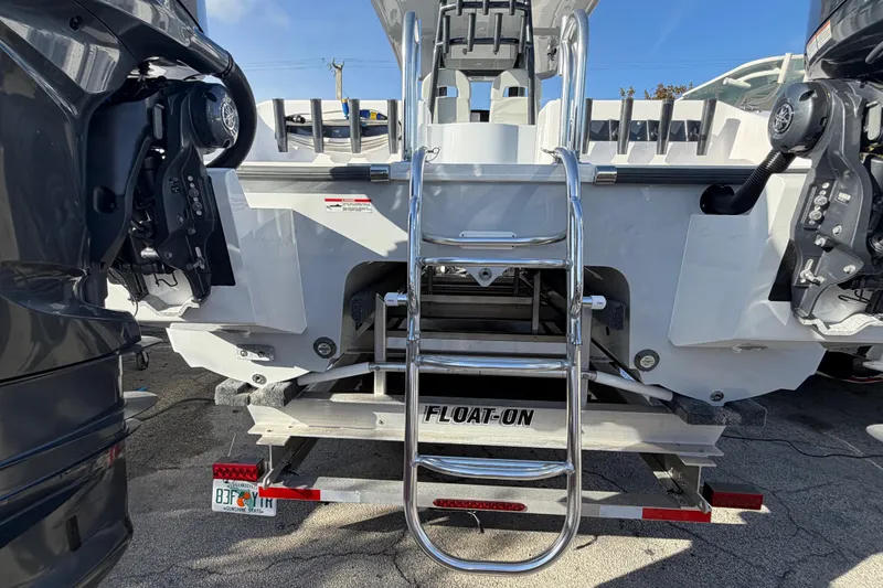  Yacht Photos Pics 2026 Twin Vee 280 GFX2 CC boat on trailer with ladder and engines.