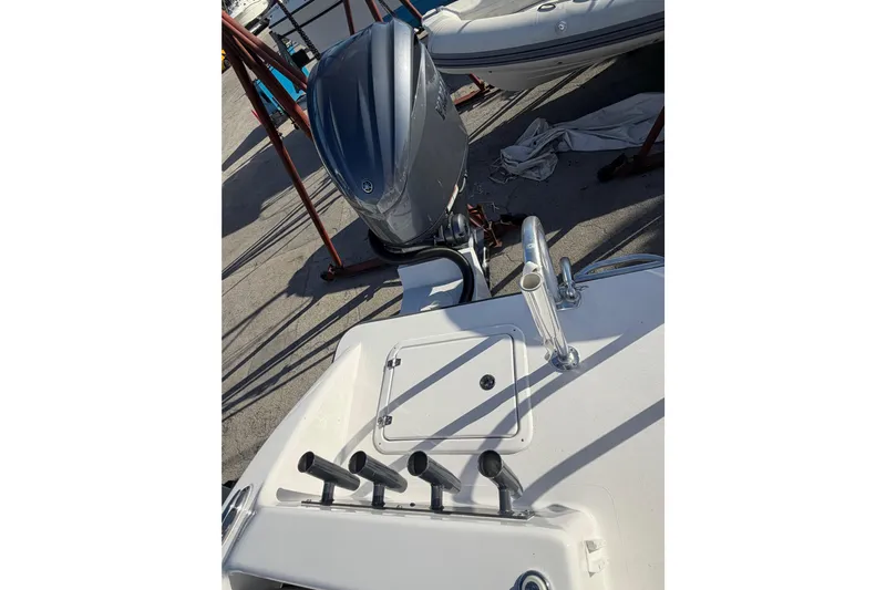  Yacht Photos Pics 2026 Twin Vee 280 GFX2 CC boat with outboard motor and control panel.