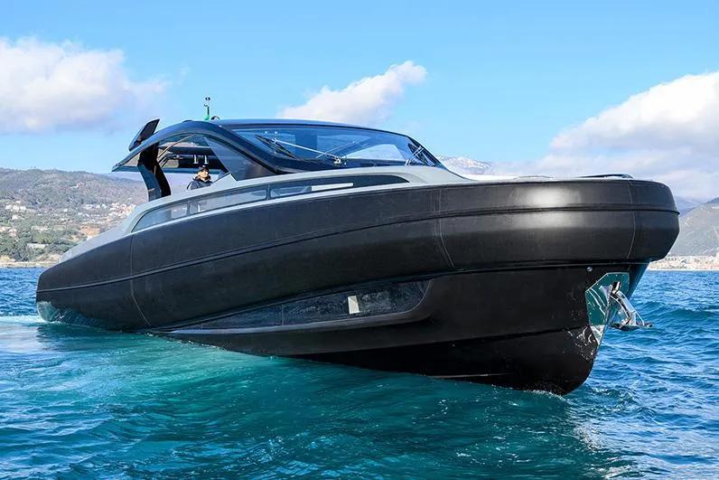 Kawa Yacht Photos Pics Manufacturer Provided Image: 2023 SACS Rebel 55 luxury yacht cruising on clear blue water.