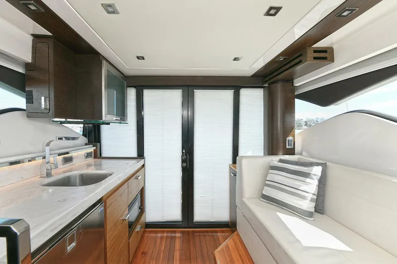 Double Diamond Yacht Photos Pics Interior of 2018 Tiara Yachts 39 Coupe with modern kitchen and seating area.