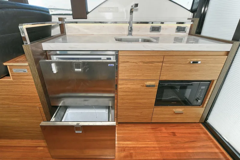 Double Diamond Yacht Photos Pics Modern kitchen area in 2018 Tiara Yachts 39 Coupe with stainless steel appliances.